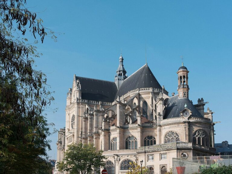 A large building with a clock on the front of it